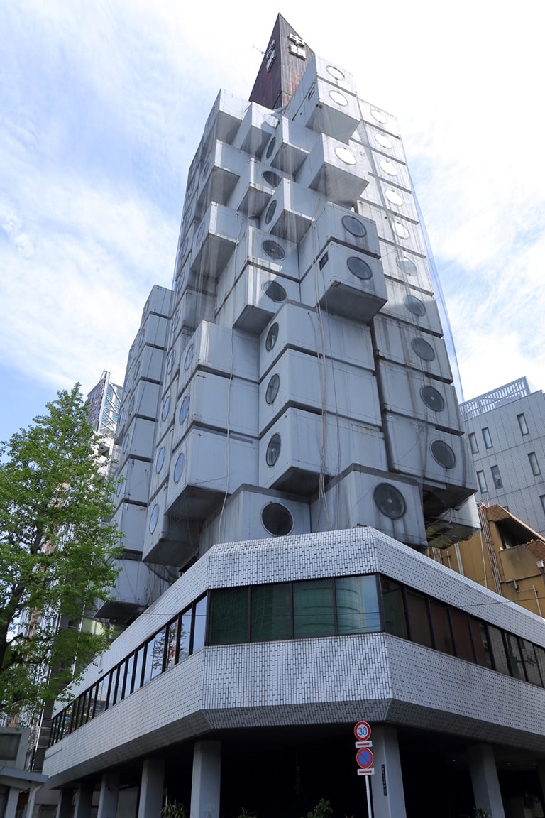 Street-level view of Nakagin Capsule Tower