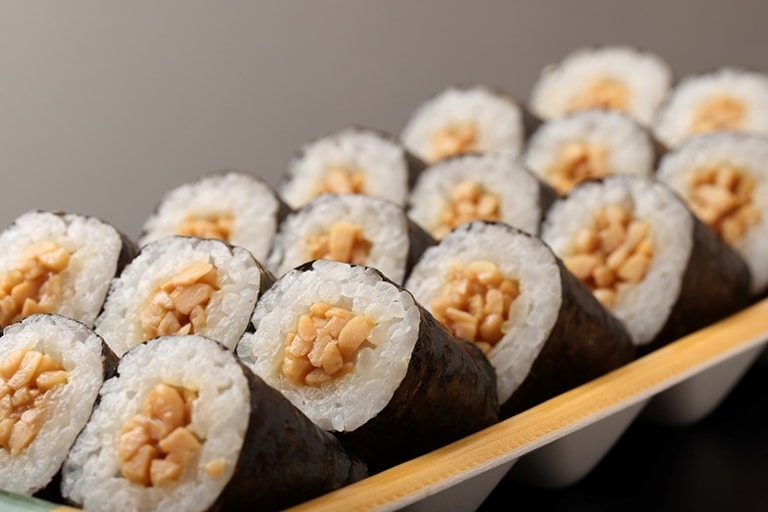 Close up of sushi rolls filled with natto