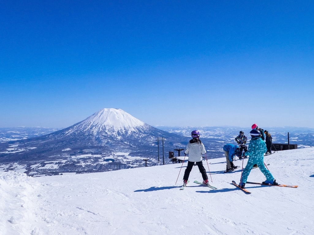 Skiers in Niseko looking at Mt. Yotei