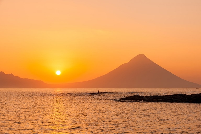 Sunset over the ocean with Mt. Iino in the background