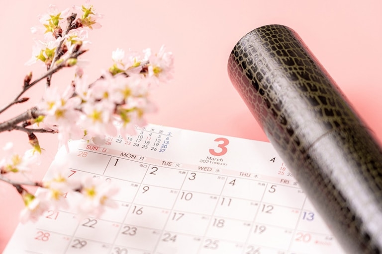 arch calendar with cherry blossoms, and a diploma case