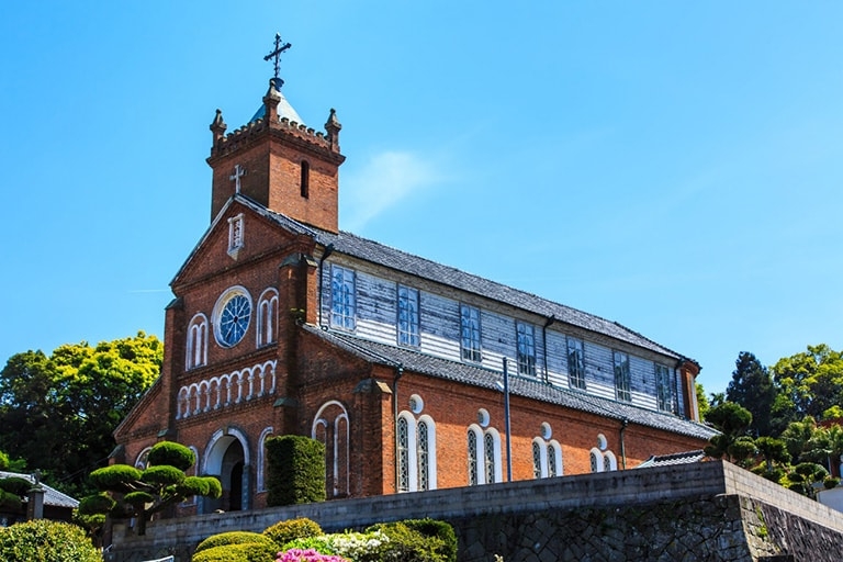 Large red brick church on a hill in Japan