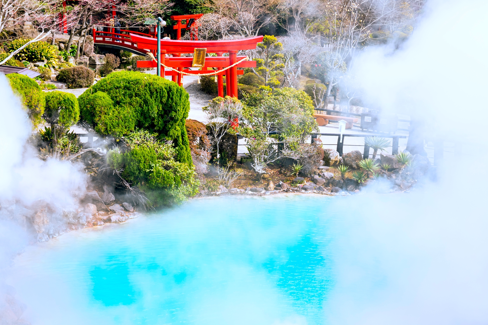 A Japanese hot spring, colored bright blue by minerals