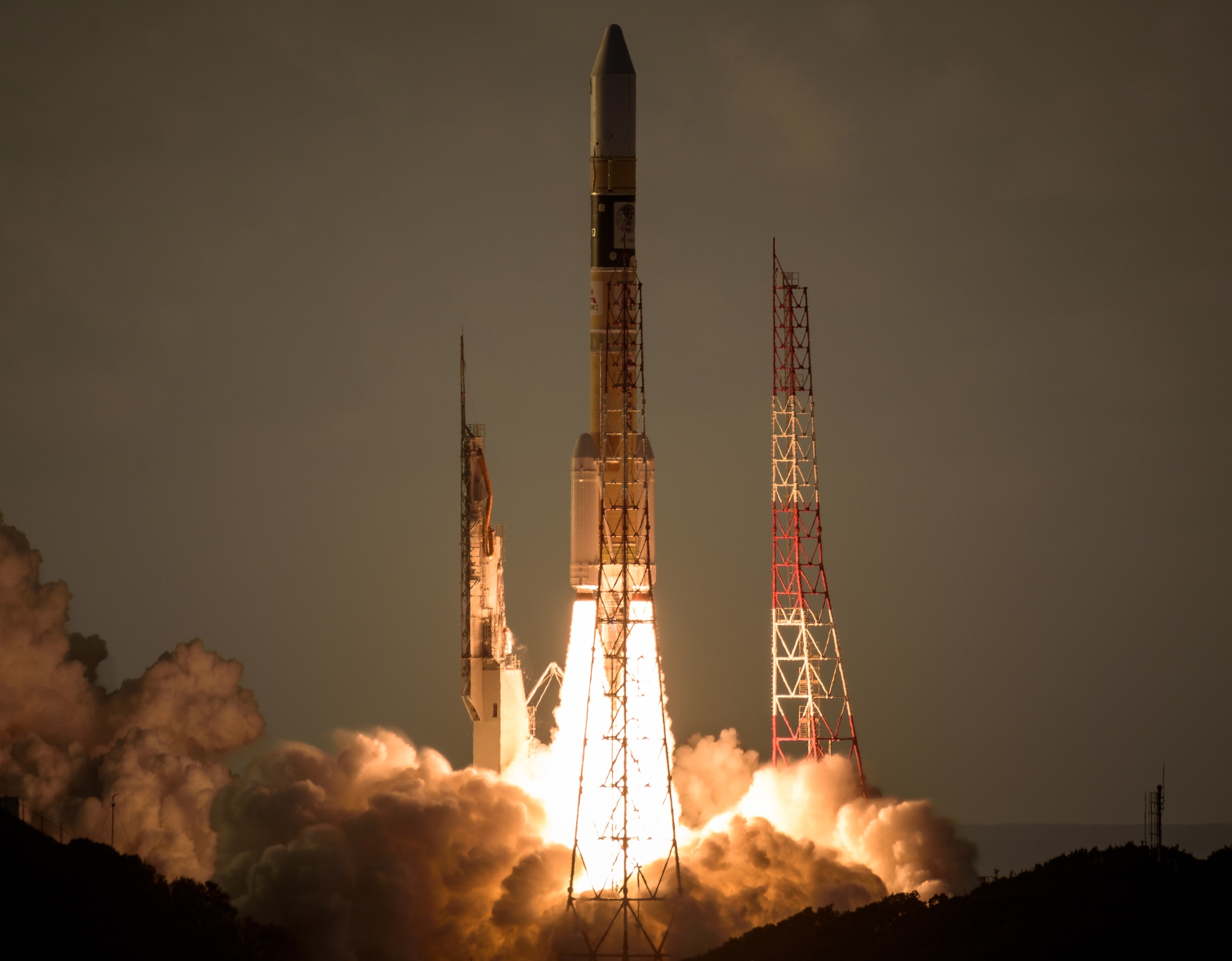 A rocket launches from Tanegashima at night