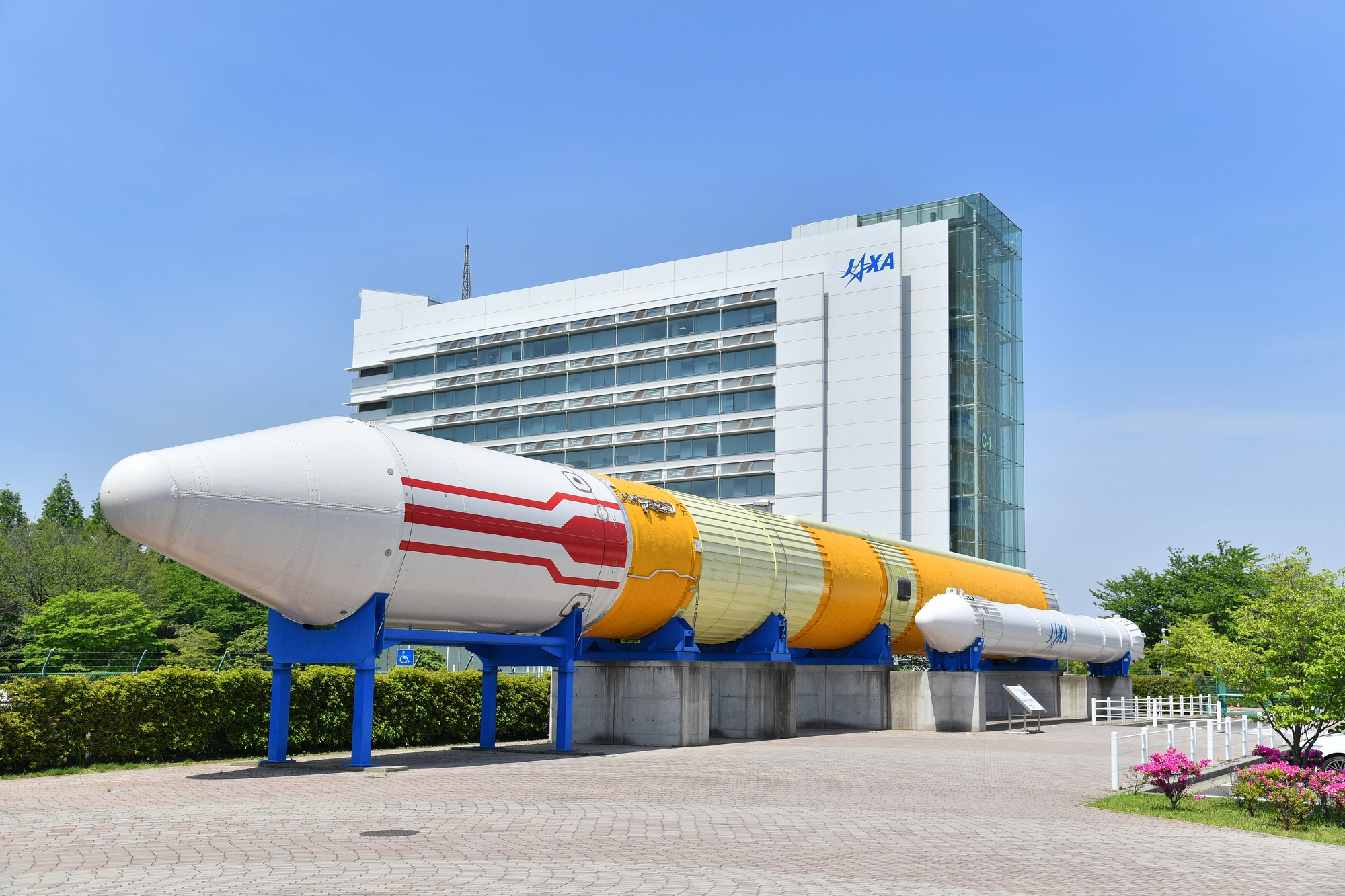 The JAXA Tsukuba Space Center, with a model rocket outside