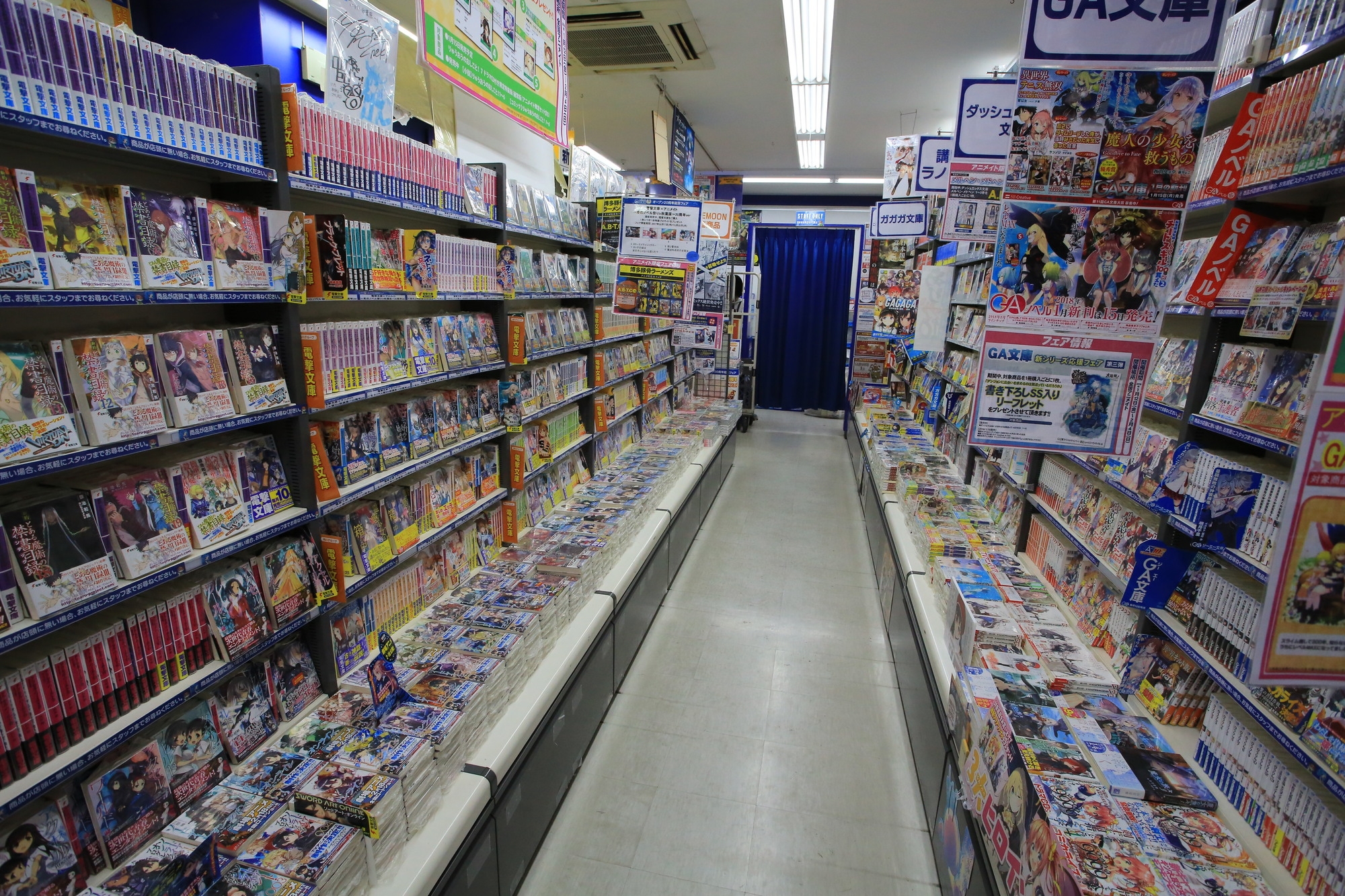 A store aisle lined with manga titles