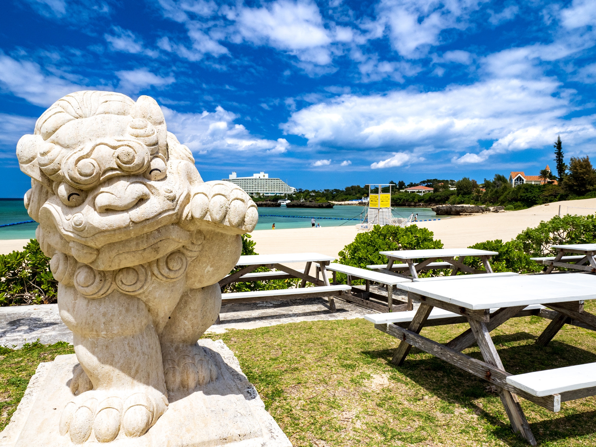 A white shisa lion statue by the beach in Okinawa