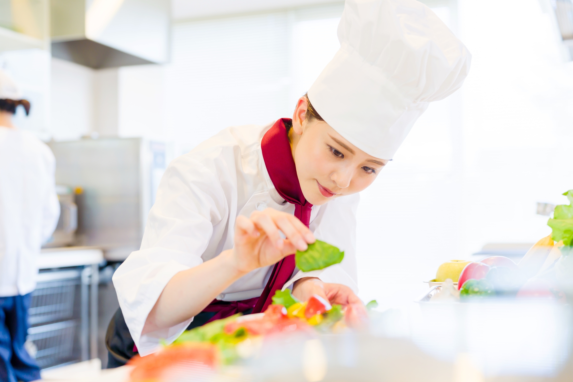 a woman in a restaurant preparing a meal