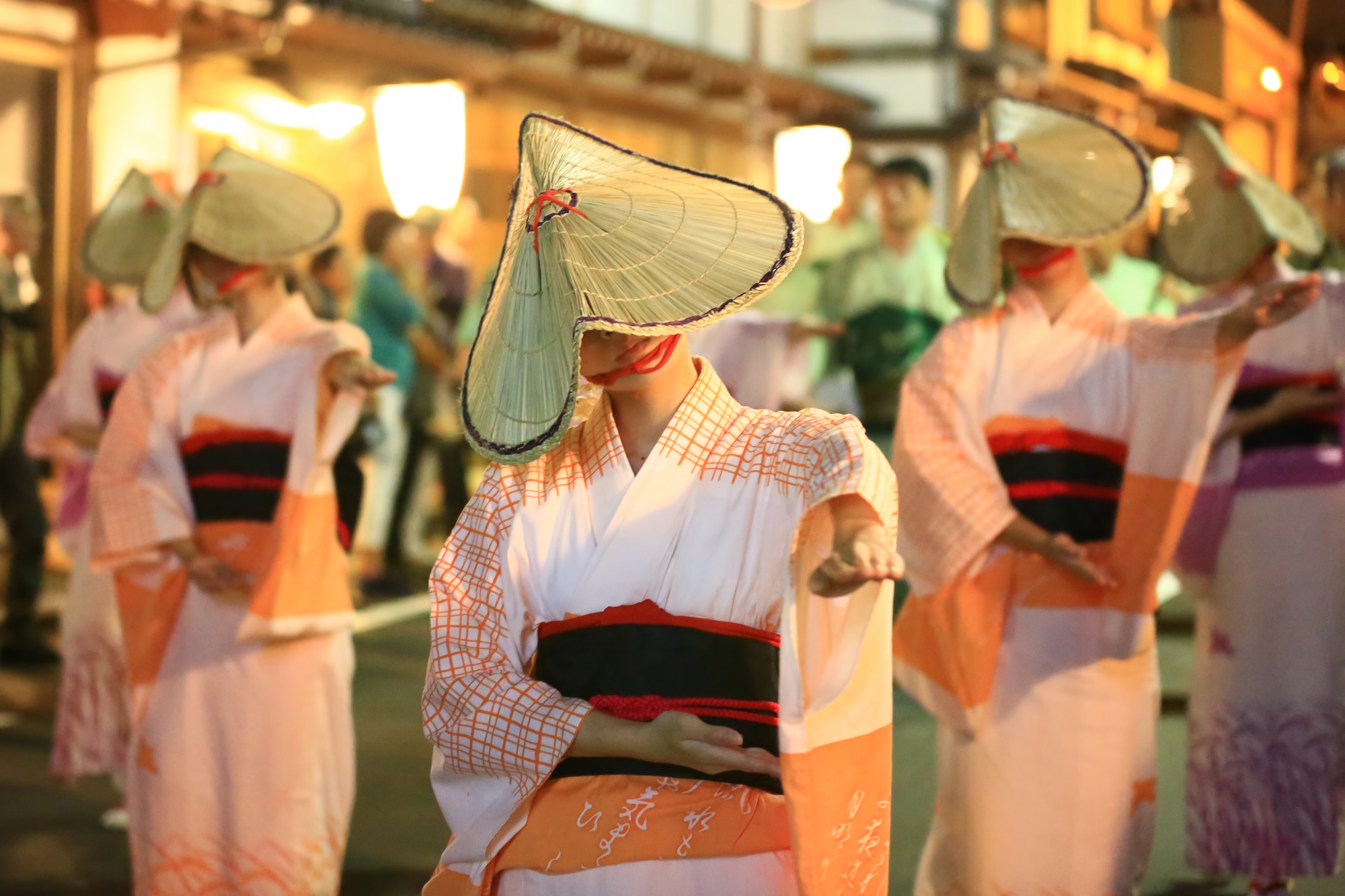 Women dancers with their faces covered