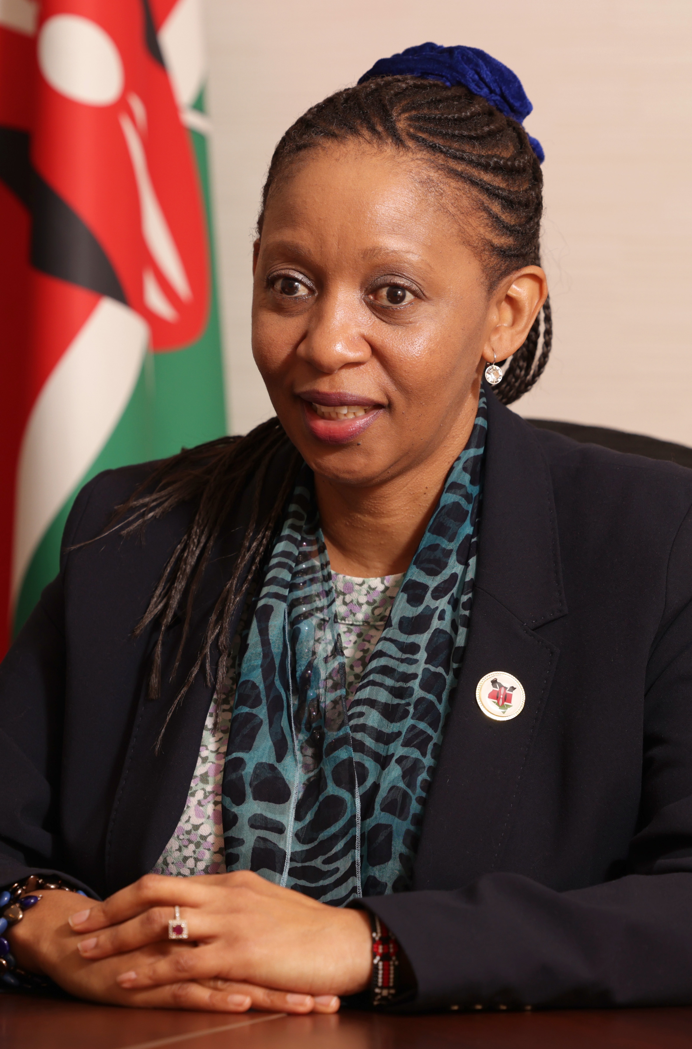 The ambassador of Kenya to Japan, seated at a table