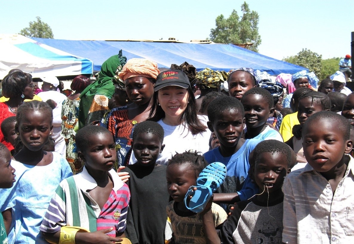 The author in Senegal, together with a group of children 