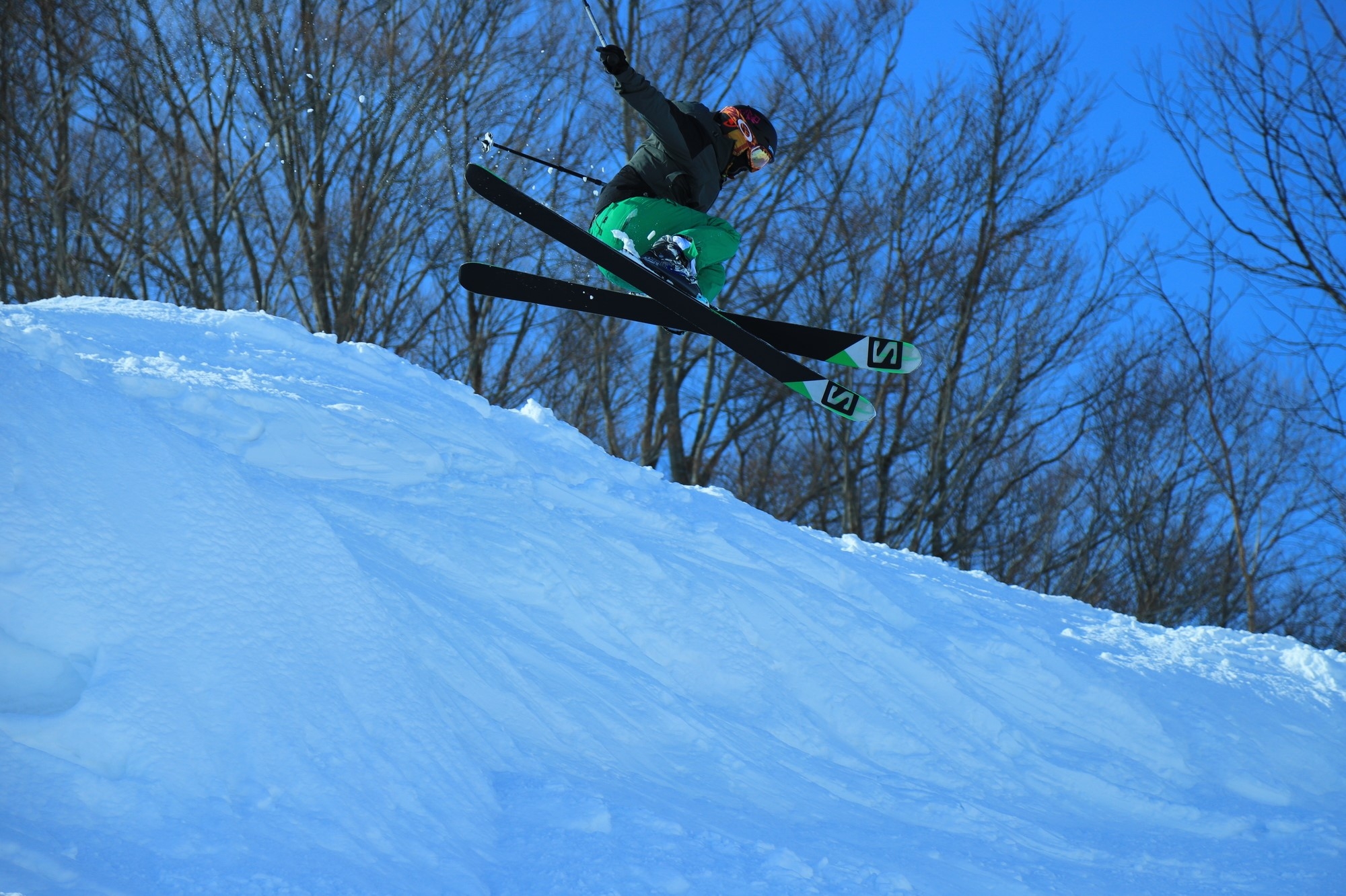 A person going over a jump on skis