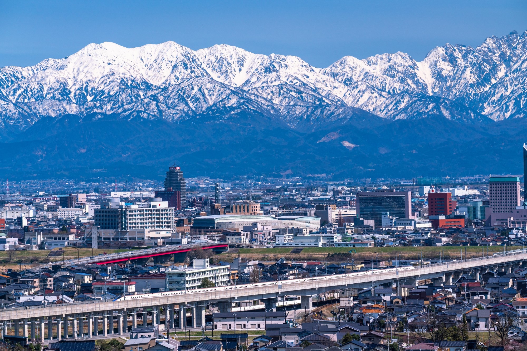 Toyama City in front of the surrounding mountains