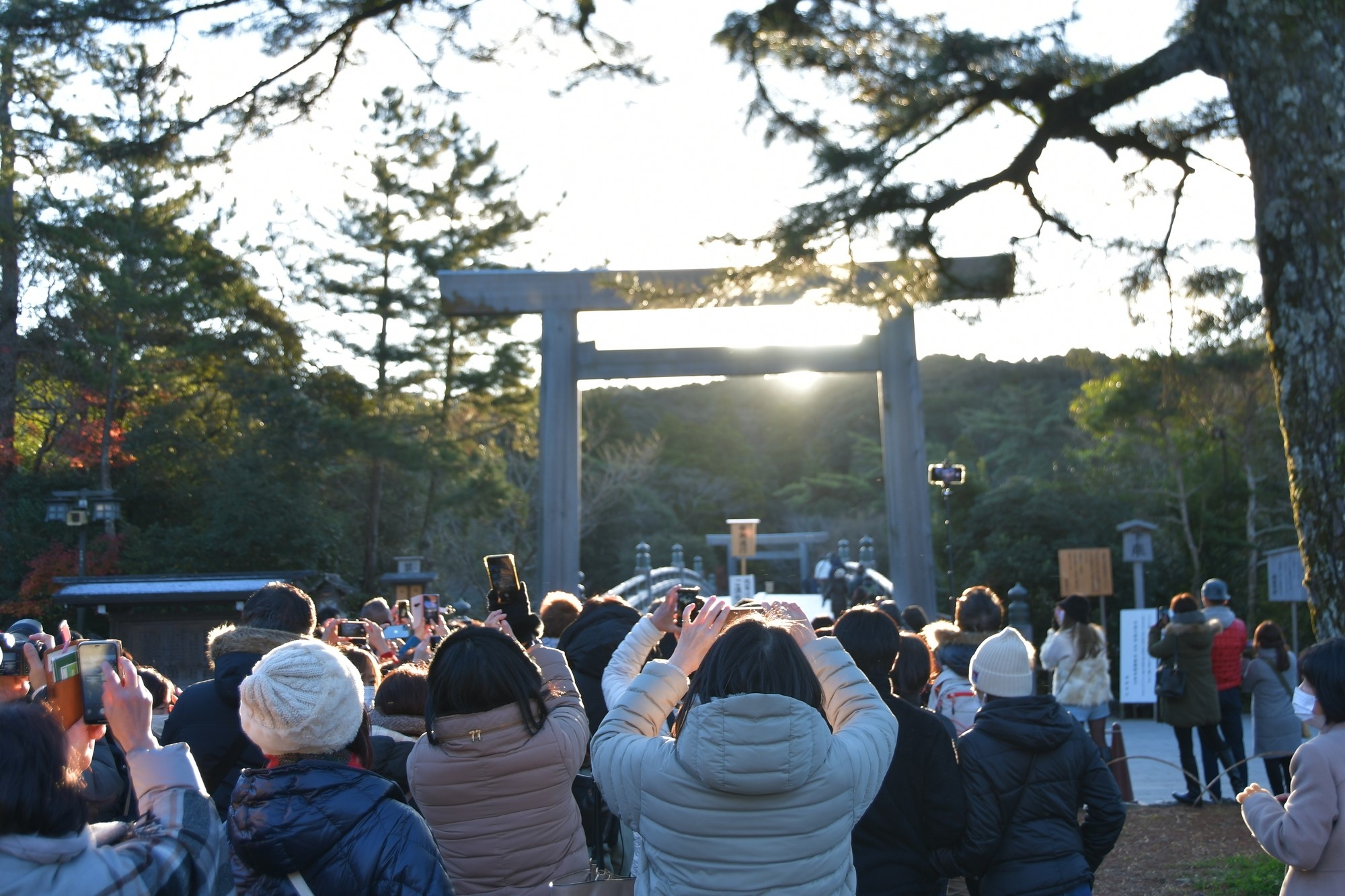 Tourists taking photos of the entrance gate at Ise Shrine