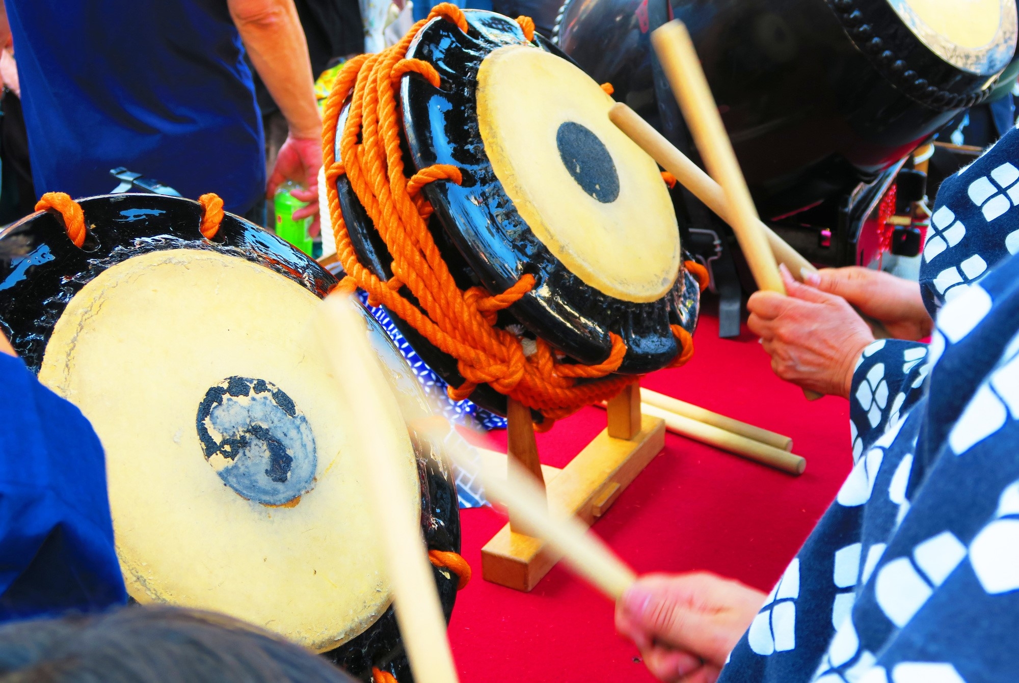 Performers beating drums