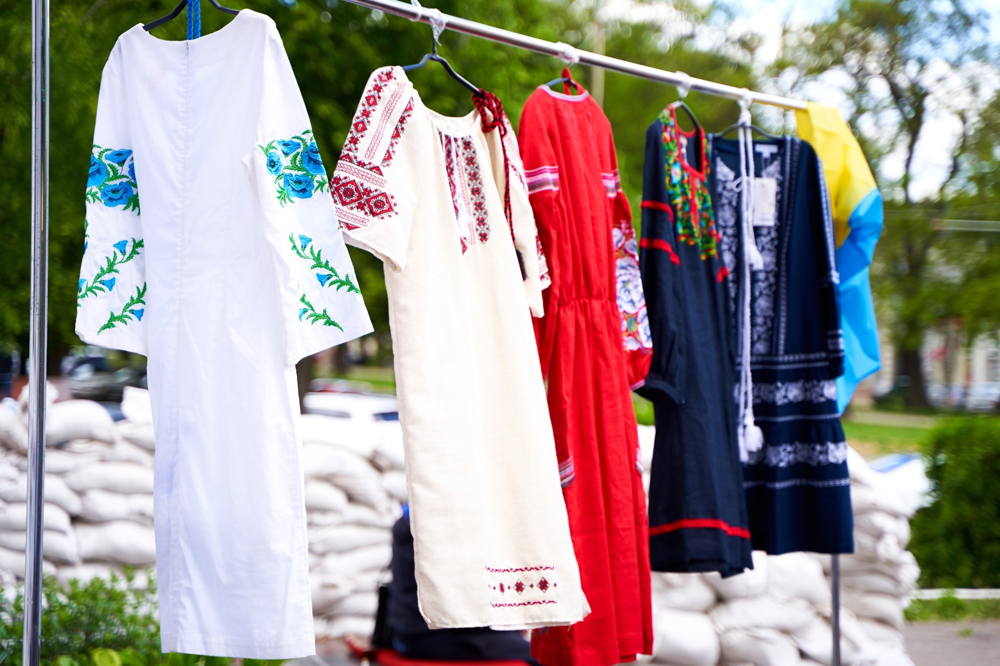 Ethnic Ukrainian clothes on hangers at an open air festival