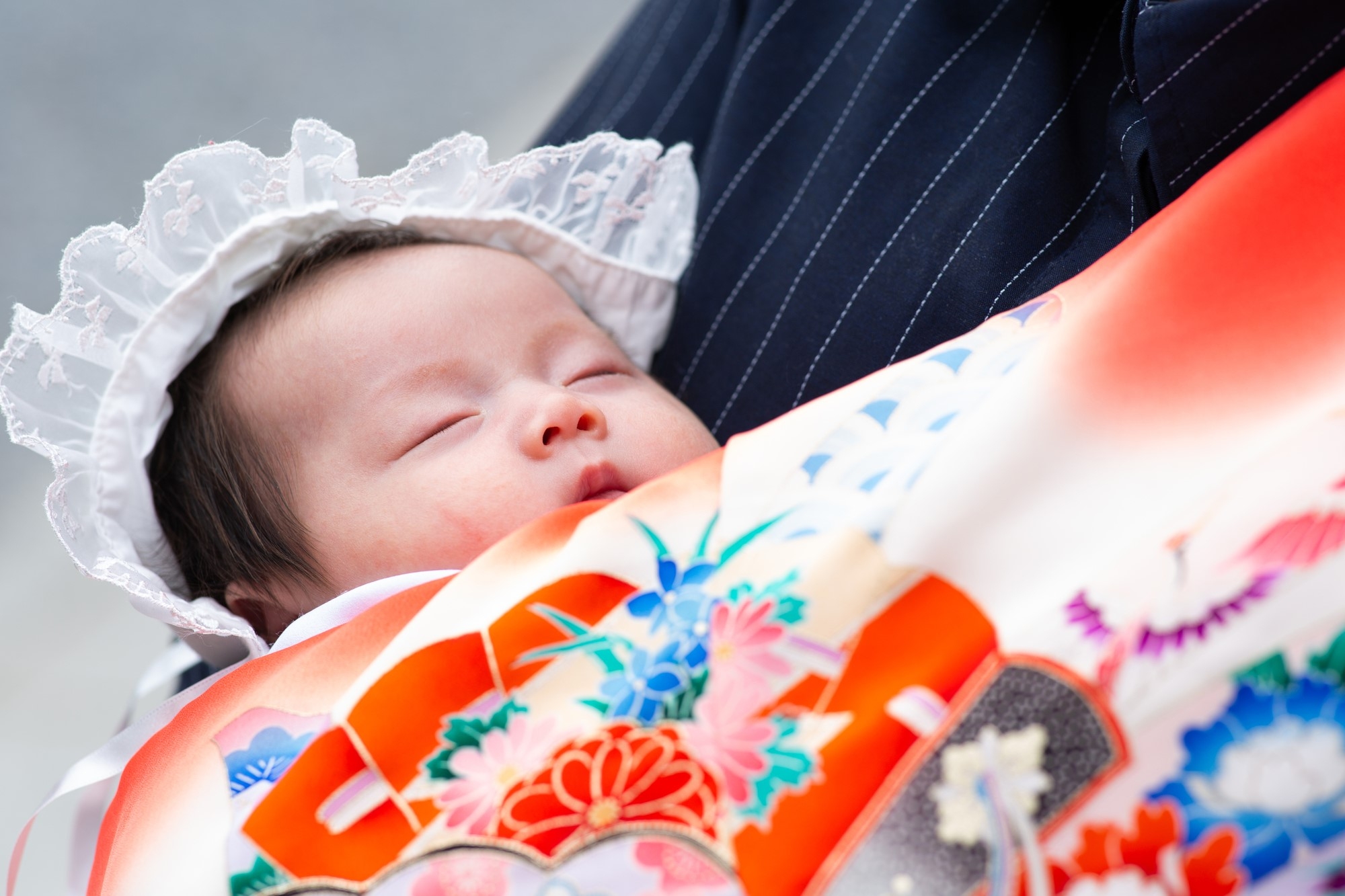 A newborn at a miyamairi ceremony