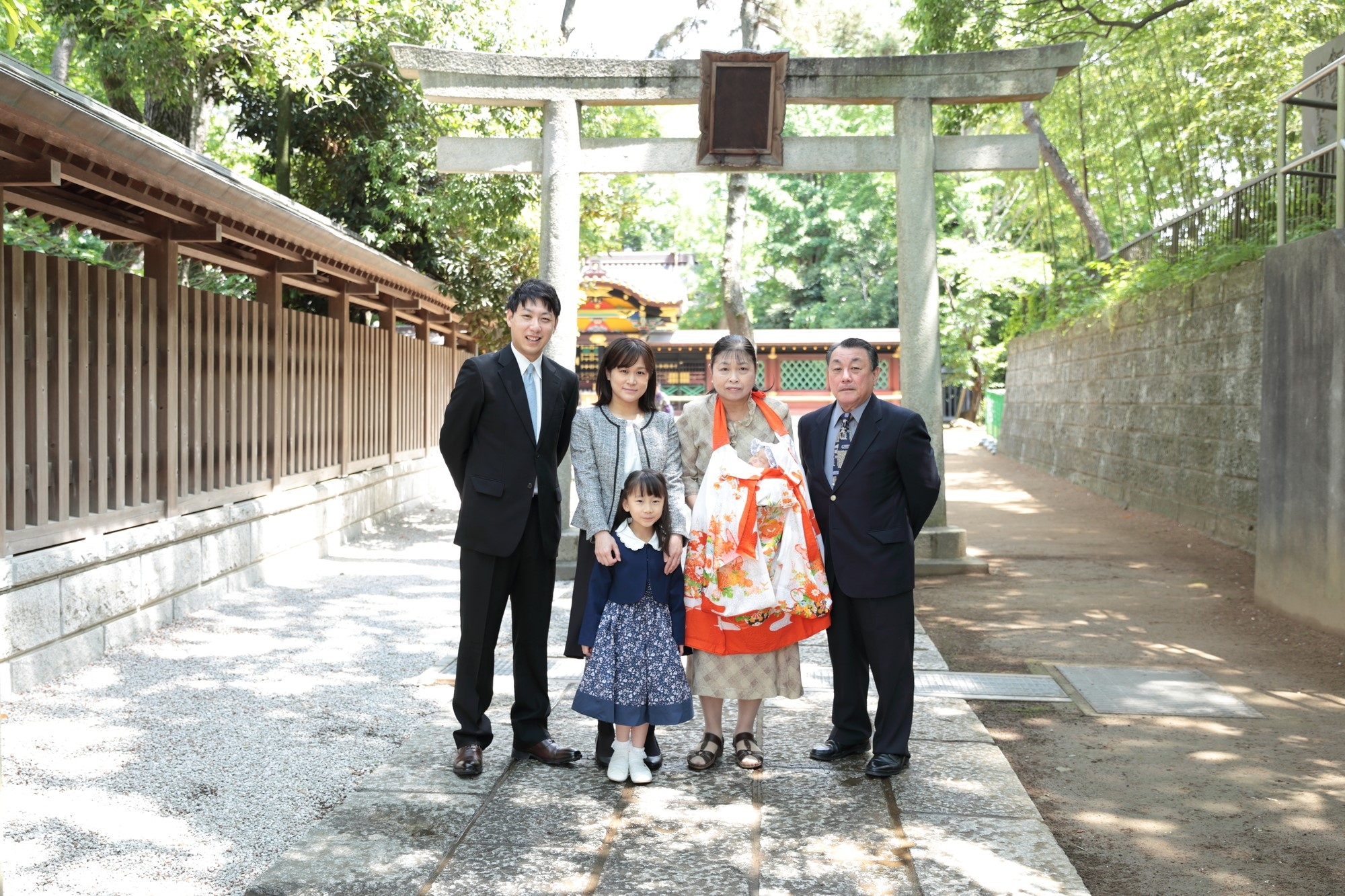 A family of three generations at a miyamairi ceremony