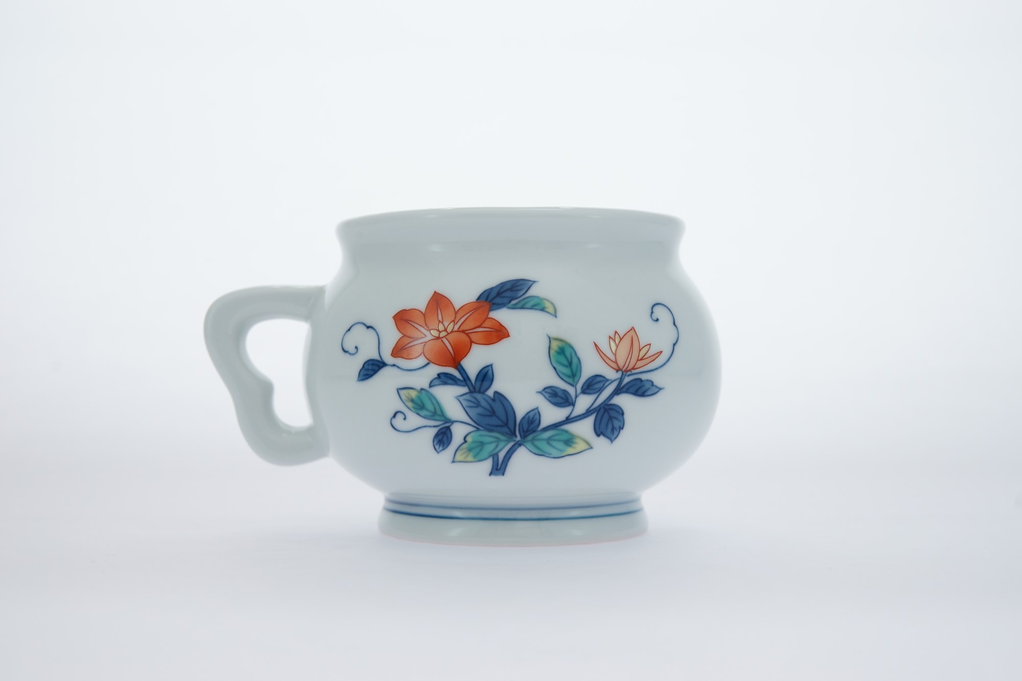 A white porcelain cup with floral prints 