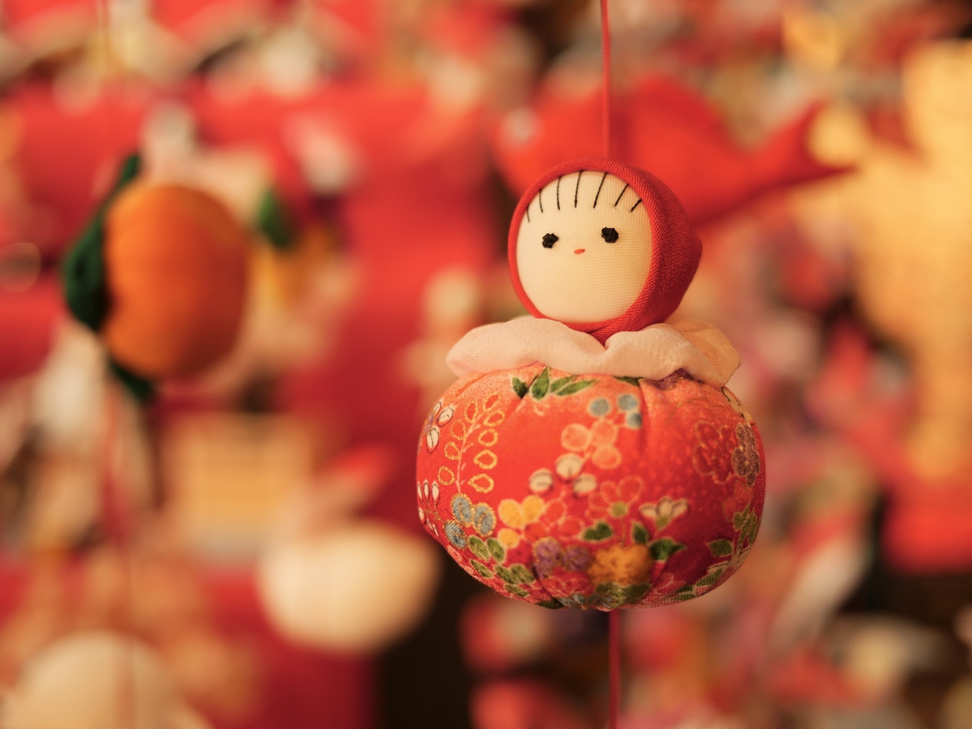 A red hanging hina doll ornament