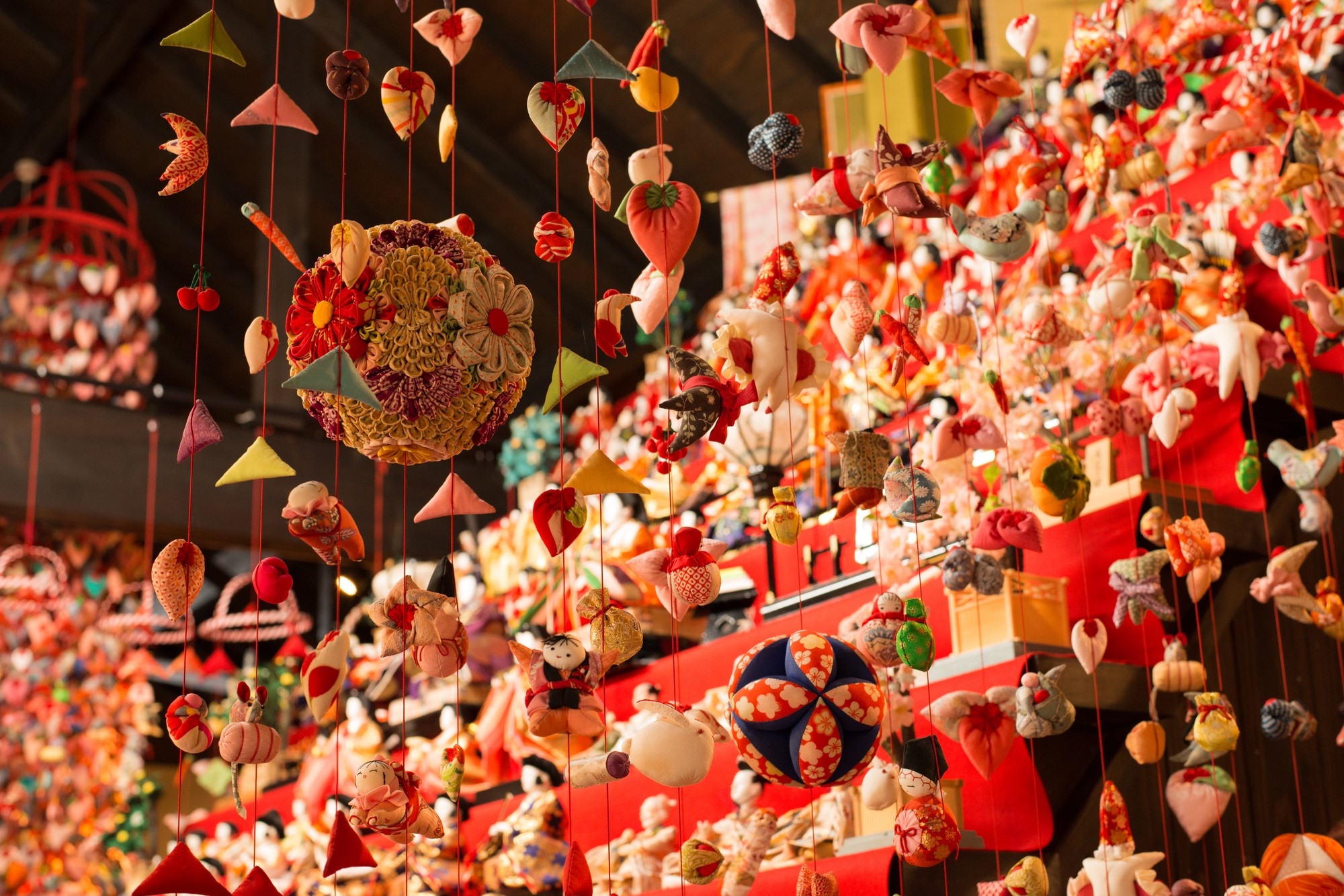 Hina doll decorations hanging from the ceiling in Inatori