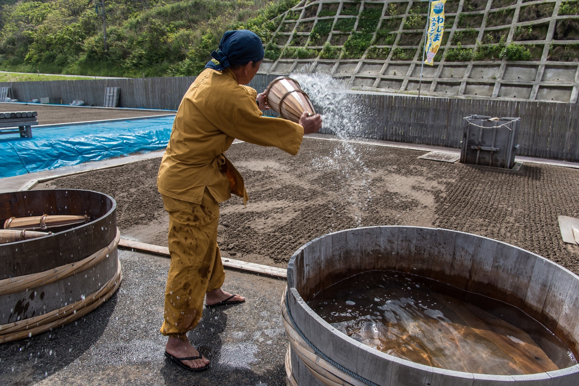 A man sprinkling water