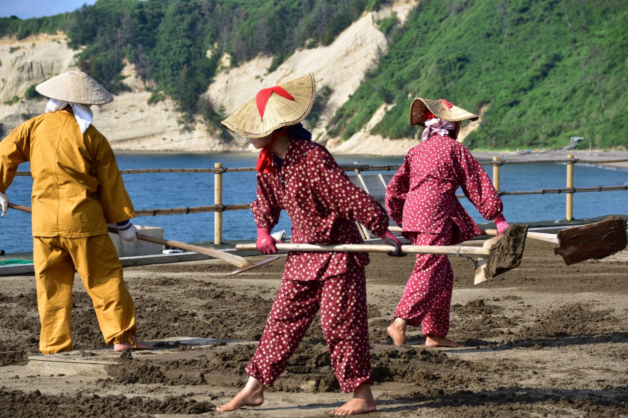 Women collecting sand