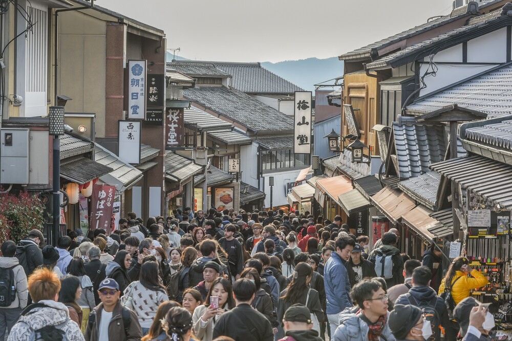 Tourists visiting Kiyomizu-dera temple and ninenzaka old town in Kyoto